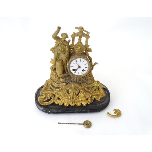 170 - A late 19thC gilt clock with figural decoration of a cooper / brewer with barrel and press. With ena... 