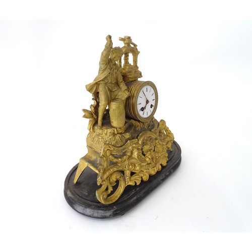 170 - A late 19thC gilt clock with figural decoration of a cooper / brewer with barrel and press. With ena... 