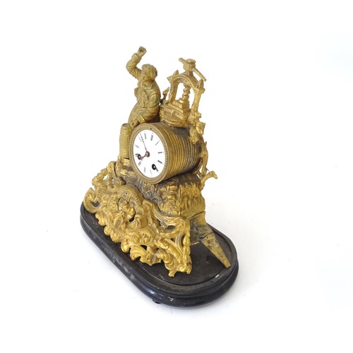 170 - A late 19thC gilt clock with figural decoration of a cooper / brewer with barrel and press. With ena... 