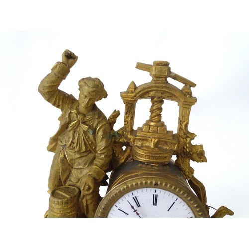 170 - A late 19thC gilt clock with figural decoration of a cooper / brewer with barrel and press. With ena... 