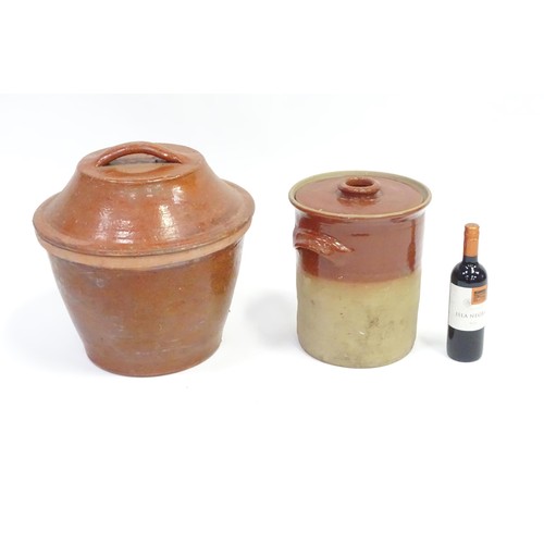 330 - A large salt glazed terracotta crock and cover, together with a stoneware pot and cover. The largest... 