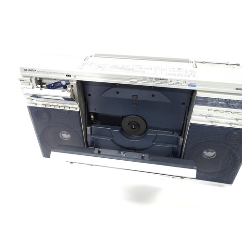 203 - A late 20thC boxed Sharp VZ-2500 portable stereo system, with turntable, tape deck, radio tuner, 4 x... 