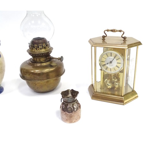 241 - A quantity of assorted items to include clock, oil lamp sections, torch, pot and cover, exceptionall... 