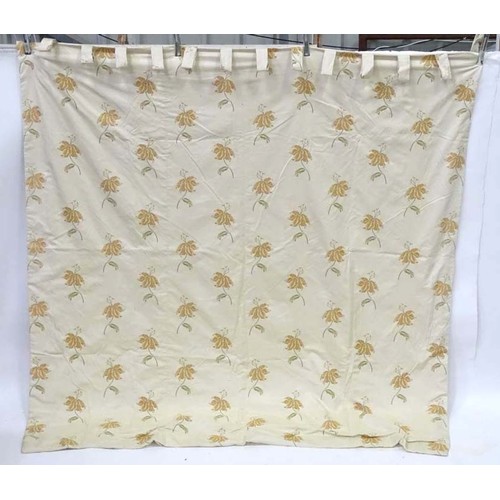 1090 - A pair of tab top curtains decorated with floral motifs, each approx 84