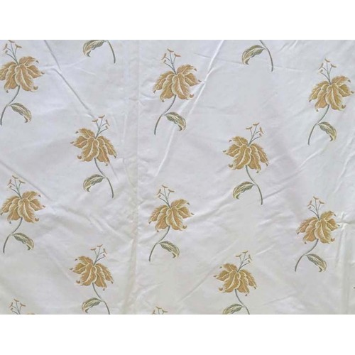 1090 - A pair of tab top curtains decorated with floral motifs, each approx 84