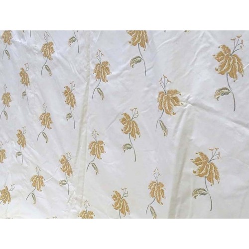 1090 - A pair of tab top curtains decorated with floral motifs, each approx 84