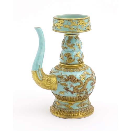 26 - A Chinese wine ewer with funnel cover, the turquoise ground decorated with gilt dragons and bats amo... 