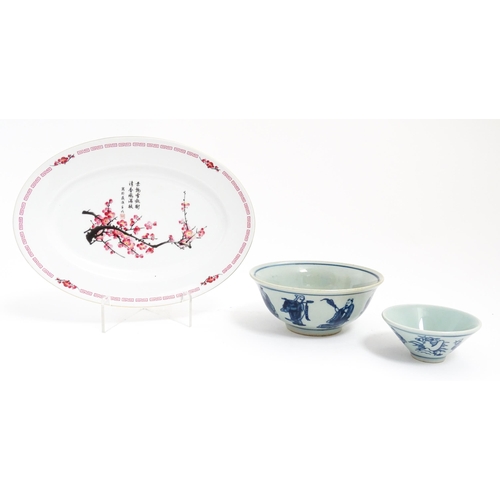 34 - Three Oriental items comprising a blue and white bowl decorated with the eight immortals, a sake bow... 