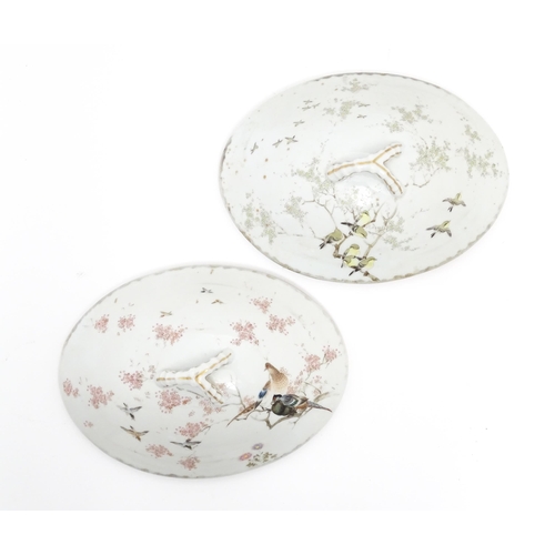 71 - A pair of Japanese tureens / lidded serving dishes with hand painted decorating various flowers and ... 