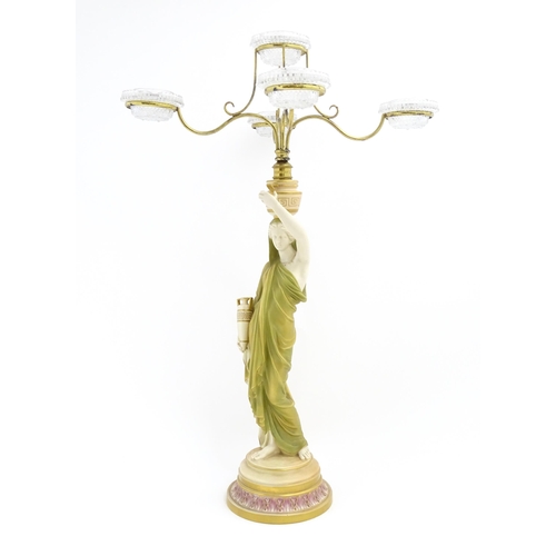 182 - A Royal Worcester five branch Cricklite candle holder modelled as a Grecian Water Carrier. With five... 