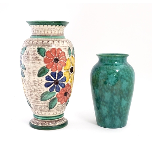 185 - A West German vase decorated with flowers. Marked under. Together with another with a mottled green ... 