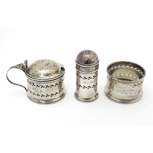 570 - A three piece silver cruet comprising mustard pot, pepper and salt frame, hallmarked Birmingham 1957... 