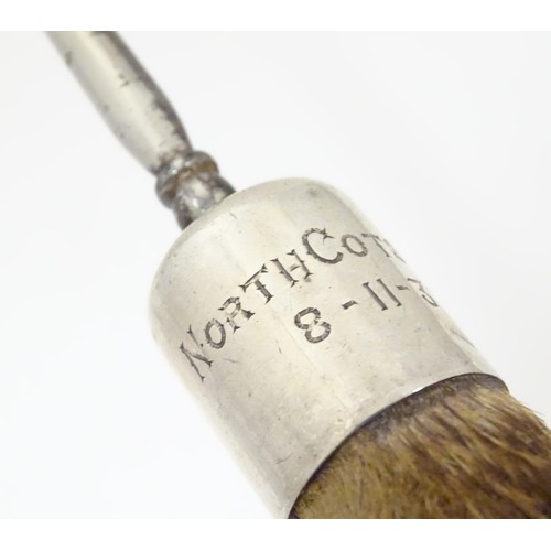 580 - Taxidermy : A button hook, the handle formed as an otter paw with silver collar engraved North Cotsw... 