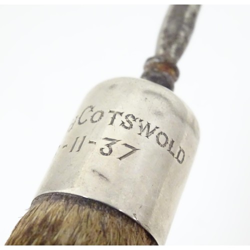 580 - Taxidermy : A button hook, the handle formed as an otter paw with silver collar engraved North Cotsw... 