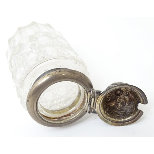 595 - A Victorian cut glass cruet bottle with a silver lid hallmarked 1893. Together with an associated wh... 