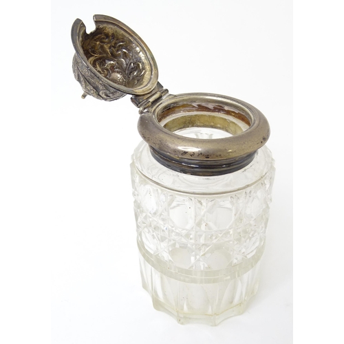 595 - A Victorian cut glass cruet bottle with a silver lid hallmarked 1893. Together with an associated wh... 