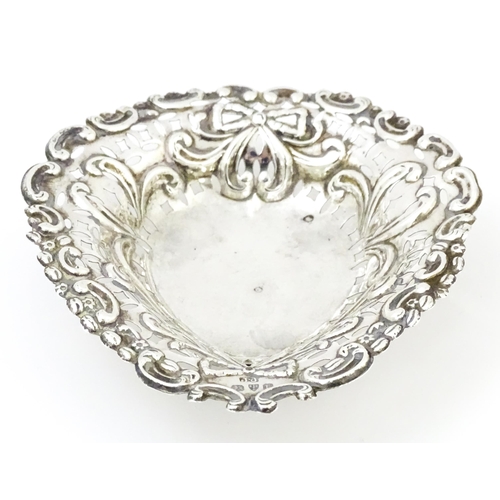 335 - A Victorian silver bon bon dish with pierced decoration and raised on ball feet, hallmarked Chester ... 