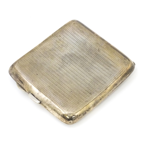 337 - An Art Deco silver cigarette case with engine turned decoration. Hallmarked Birmingham 1937 maker Fr... 