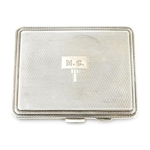 340 - An Art Deco silver compact of rectangular form with engine turned decoration hallmarked Birmingham 1... 