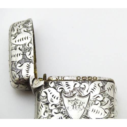 341 - A Victorian silver vesta case with engraved decoration, hallmarked Birmingham 1890. Approx. 1 3/4