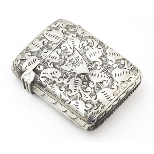 341 - A Victorian silver vesta case with engraved decoration, hallmarked Birmingham 1890. Approx. 1 3/4