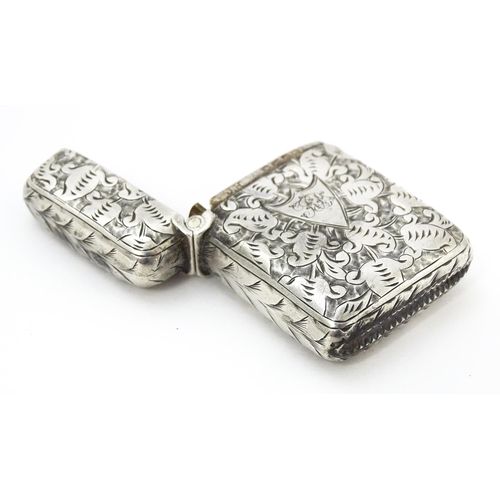 341 - A Victorian silver vesta case with engraved decoration, hallmarked Birmingham 1890. Approx. 1 3/4