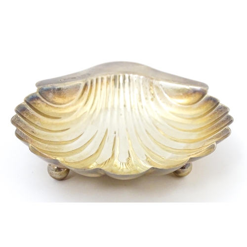 343 - A silver butter dish of shell form hallmarked Birmingham 1904, maker M. G. Collingwood & Son. Approx... 