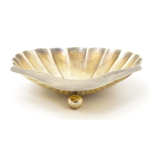 343 - A silver butter dish of shell form hallmarked Birmingham 1904, maker M. G. Collingwood & Son. Approx... 