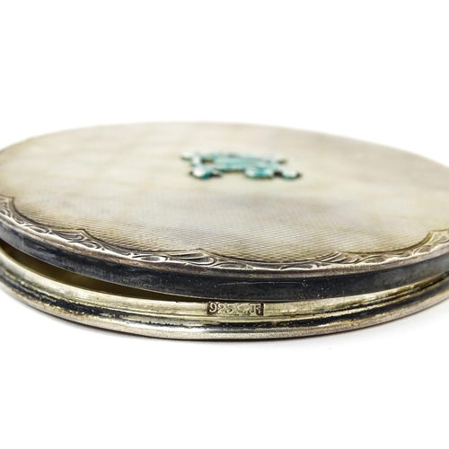 344 - A .925 silver powder compact with engine turned decoration. Approx. 3 1/4