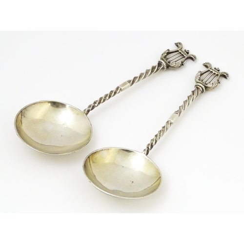 349 - A pair of Victorian silver serving spoons with twist handles and lyre finials, hallmarked London 189... 