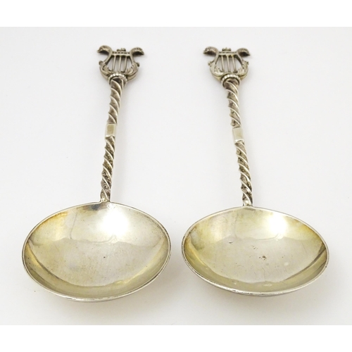 349 - A pair of Victorian silver serving spoons with twist handles and lyre finials, hallmarked London 189... 