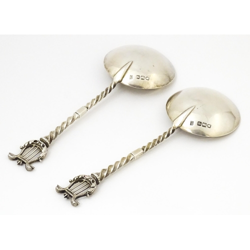 349 - A pair of Victorian silver serving spoons with twist handles and lyre finials, hallmarked London 189... 