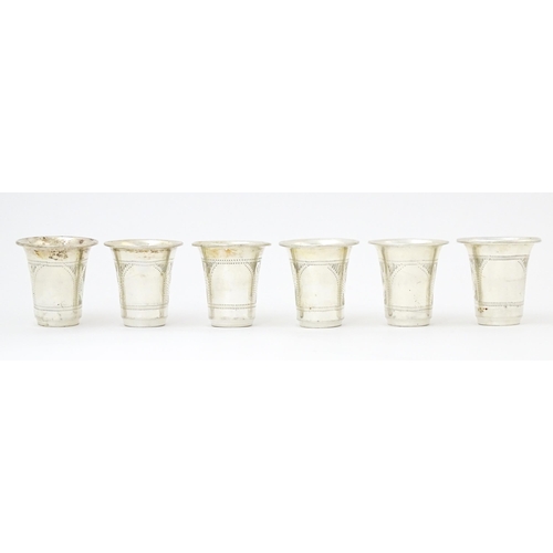 353 - Judaica Interest: Six silver kiddish / tot cups hallmarked London 1921 / 1922, maker M Salkind. Appr... 