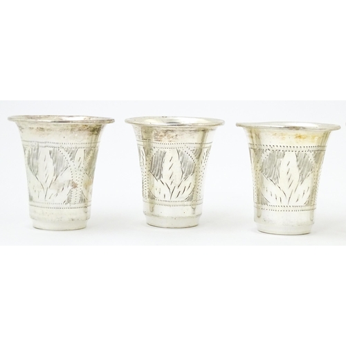 353 - Judaica Interest: Six silver kiddish / tot cups hallmarked London 1921 / 1922, maker M Salkind. Appr... 