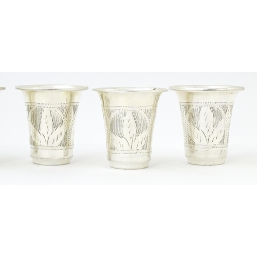 353 - Judaica Interest: Six silver kiddish / tot cups hallmarked London 1921 / 1922, maker M Salkind. Appr... 