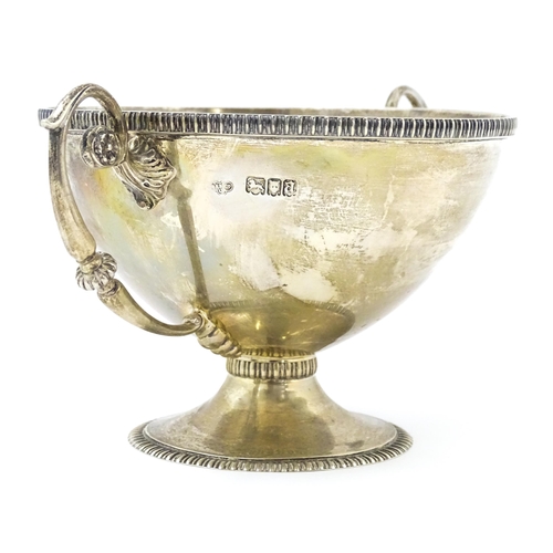 355 - A silver pedestal bowl with twin handles hallmarked London 1916, maker Goldsmiths & Silversmiths Co.... 