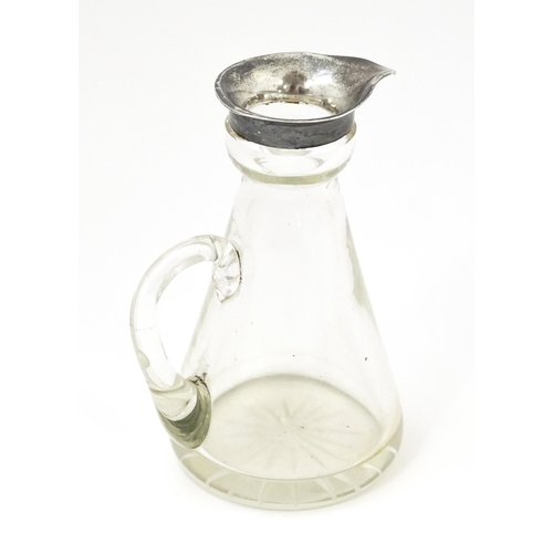 356 - A glass whiskey water jug / noggin with silver mount hallmarked Birmingham 1909, maker Levi & Salama... 