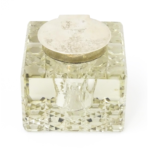 363 - A glass inkwell of squared form with silver lid hallmarked Chester 1914, maker E. J. Clewley & Co. A... 