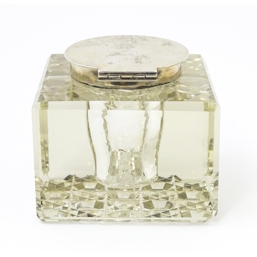 363 - A glass inkwell of squared form with silver lid hallmarked Chester 1914, maker E. J. Clewley & Co. A... 