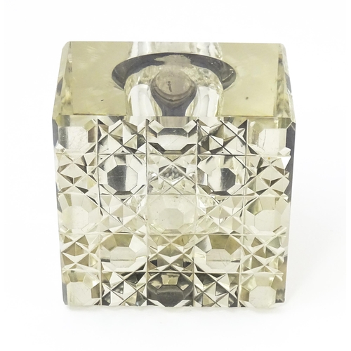 363 - A glass inkwell of squared form with silver lid hallmarked Chester 1914, maker E. J. Clewley & Co. A... 