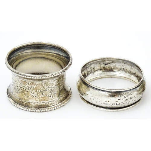 364 - Four various 20thC silver napkin rings to include examples with engine turned decoration etc. (4)