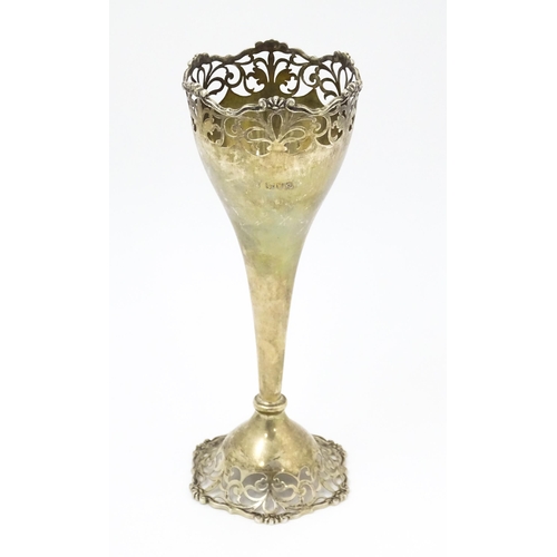 367 - A silver bud vase with openwork decoration hallmarked London 1911, maker Josiah Williams & Co. Appro... 