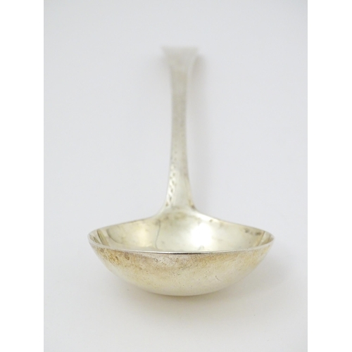 368 - A Geo III silver sauce ladle with bright cut decoration hallmarked London c. 1778, maker Stephen Ada... 