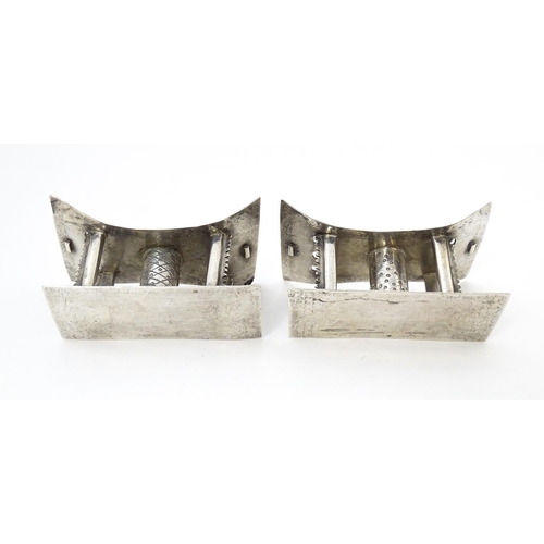 376 - A pair of white metal knife rests formed as African tribal Ashanti / Asante stools. Approx. 2 3/4