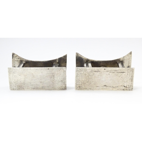 376 - A pair of white metal knife rests formed as African tribal Ashanti / Asante stools. Approx. 2 3/4