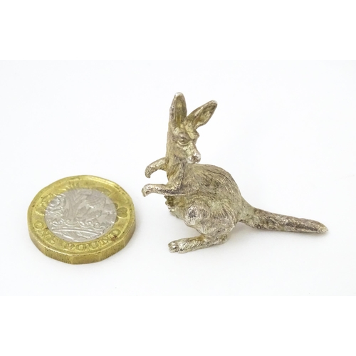 377 - A silver model of a kangaroo and joeys, hallmarked London 2001. Approx. 1 1/2