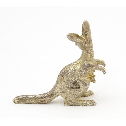 377 - A silver model of a kangaroo and joeys, hallmarked London 2001. Approx. 1 1/2