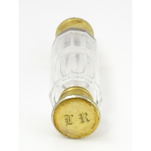 380 - A Victorian glass double ended salts / scents bottle with silver gilt lids, hallmarked London 1860, ... 