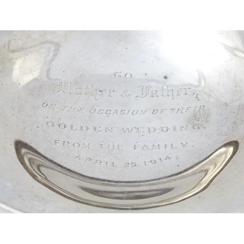 388 - A silver tazza with pierced decoration and scrolling twin handles, hallmarked Sheffield 1911, maker ... 