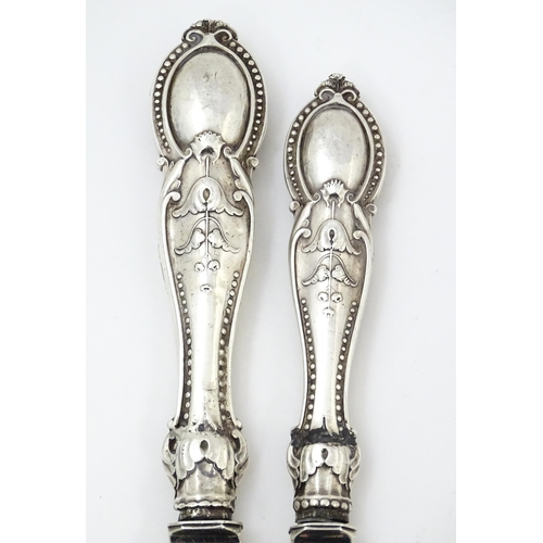 390 - A pair of Victorian silver fish servers hallmarked Birmingham 1865, maker Thomas Prime & Son. Larges... 